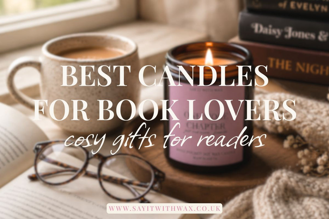 A cosy reading scene with a lit candle in a purple jar, glasses on an open book, a mug of tea, and stacked books in the background. Best Candles for Book Lovers title overlay.