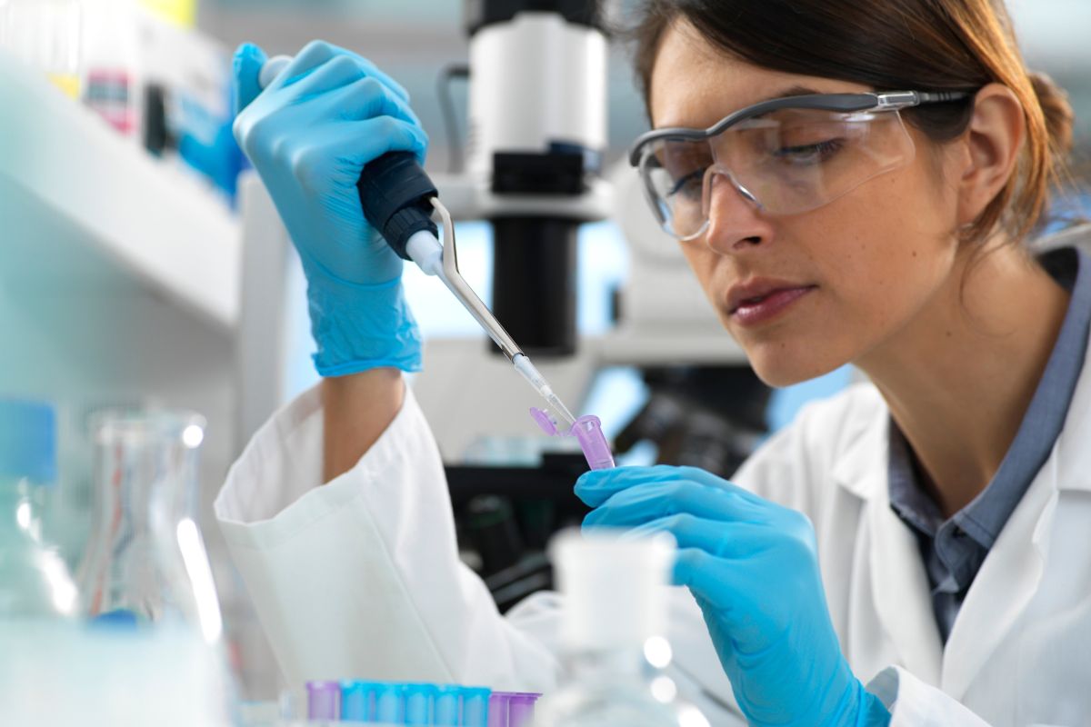 Scientist testing fragrance ingredients in a laboratory, representing research into candle and fragrance oil safety.