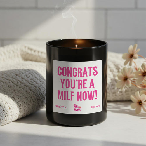 Congrats You’re a MILF Now soy wax candle in matte black glass jar with pink label and ash wooden lid, funny new mum gift, baby shower present
