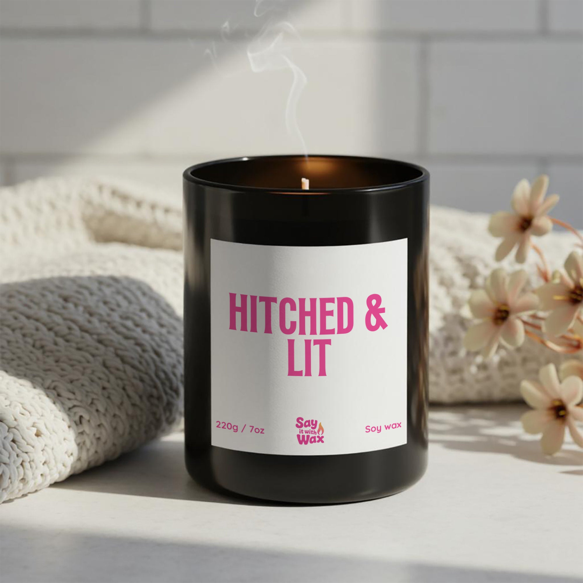 Hitched & Lit soy wax candle in matte black glass jar with pink label and ash wooden lid, funny LGBTQ+ wedding, engagement and bridal shower gift