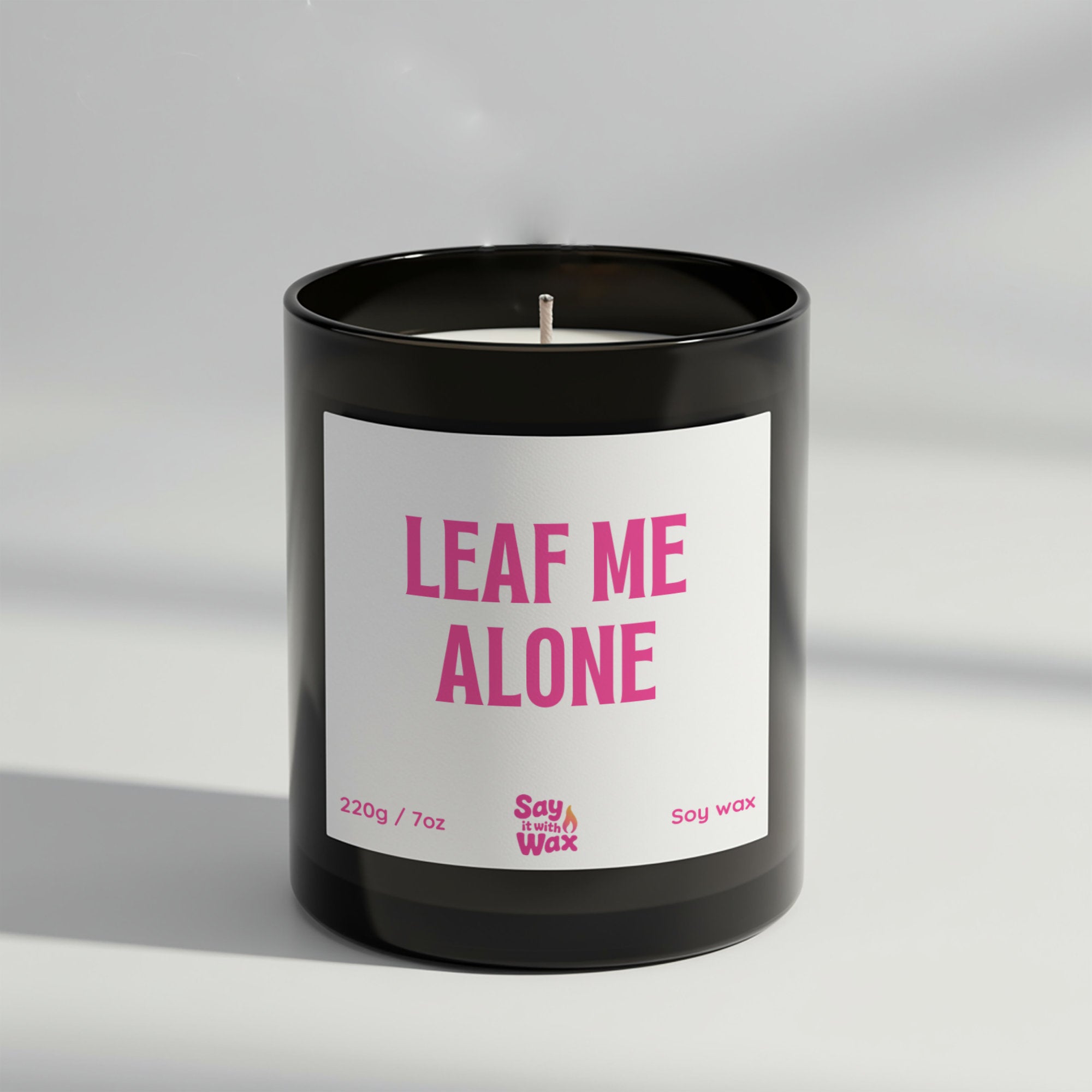Leaf Me Alone soy wax candle in matte black glass jar with green label and ash wooden lid, autumn home décor scented with Blackberry & Bay