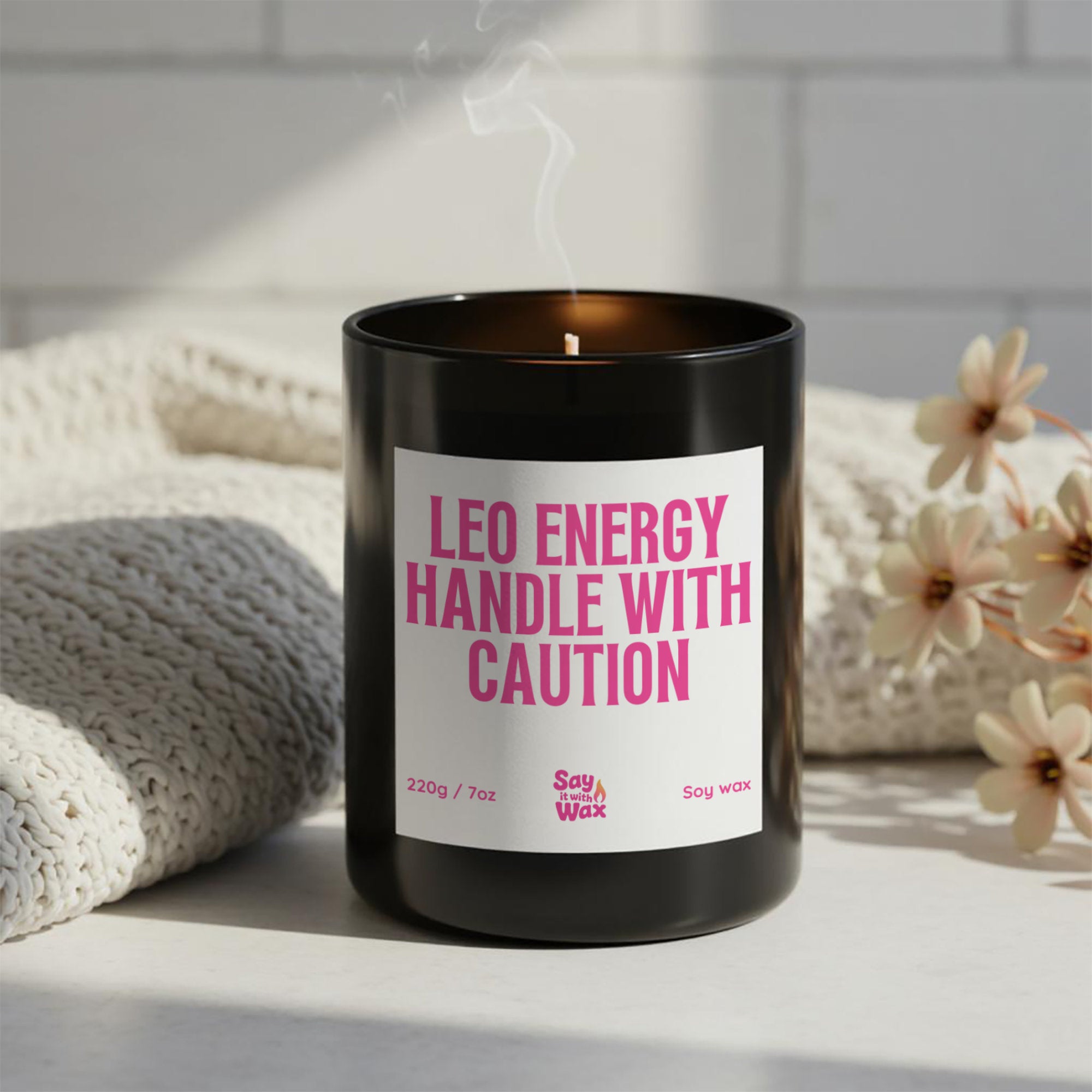 Leo Energy Handle with Caution soy wax candle in matte black glass jar with pink label, astrology zodiac birthday gift for Leos