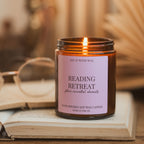 Lit Reading Retreat soy candle on an open book, with reading glasses and warm blurred pages in the background.