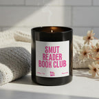 Smut Reader Book Club soy wax candle in matte black glass jar with pink label and ash wooden lid, funny romance reader and book club gift