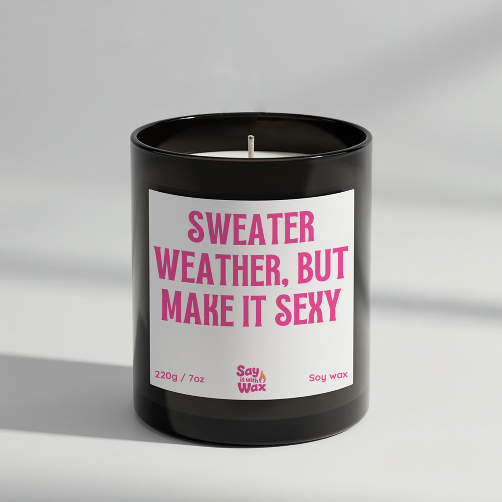 Sweater Weather But Make It Sexy soy wax candle in matte black glass jar with seasonal label and ash wooden lid, scented with deep Black Pomegranate
